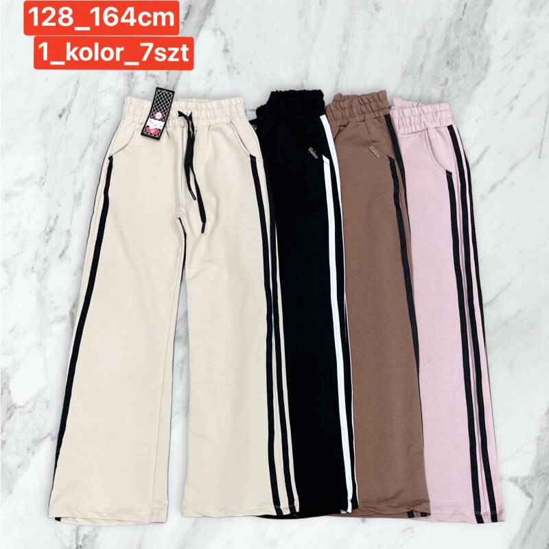Spodnie dziewczęcy. Roz 128-164. 1 kolor Paczka 7 szt .