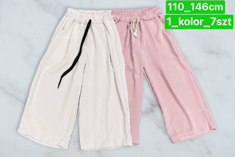 Spodnie dziewczęcy. Roz 110-146. 1 kolor Paczka 7 szt .